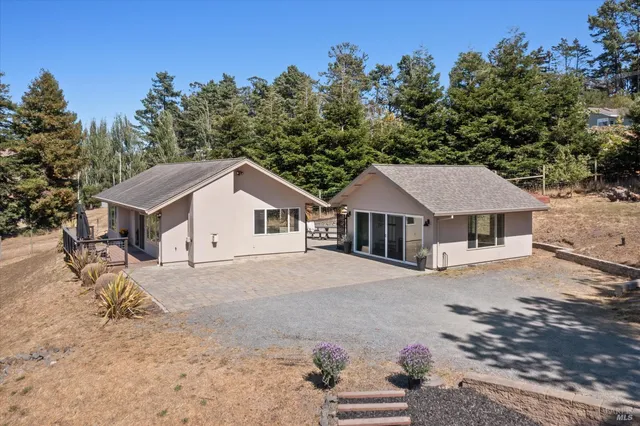 a living room with furniture a clock and a window