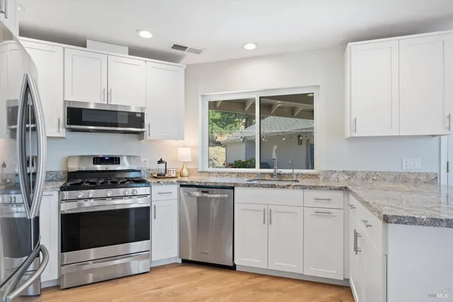 a bedroom with a bed and a chair