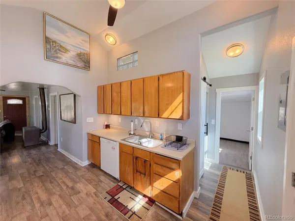 a spacious bathroom with a mirror sink and vanity