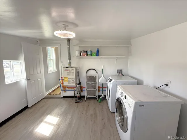 a view of a livingroom with furniture and a window