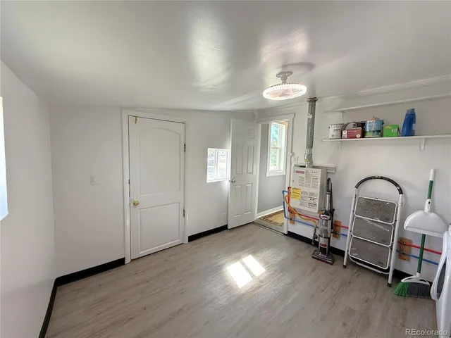 a bedroom with a bed and a mirror