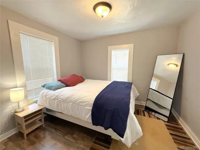 a bedroom with a bed and window