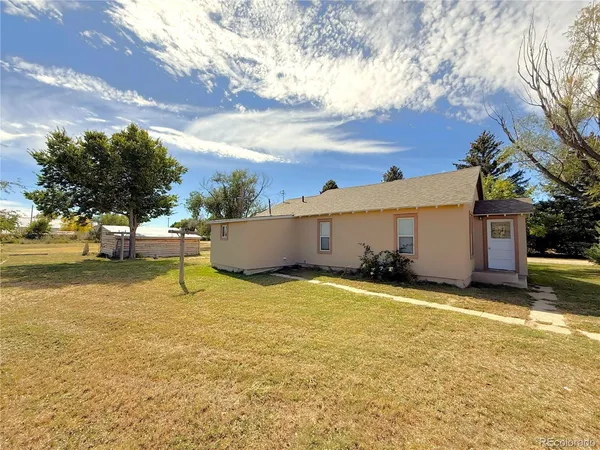 a view of an house with swimming pool and porch