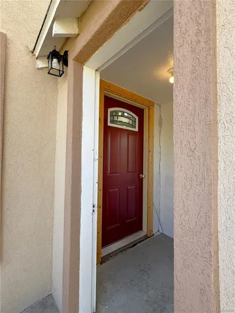 a view of a hallway with a glass door