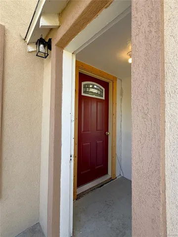a view of a hallway with a glass door