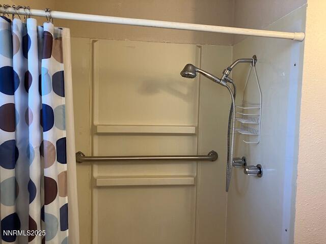 730 James Court Reno, NV 89503 - Photo 14 of 21 a bathroom with a shower and a glass door