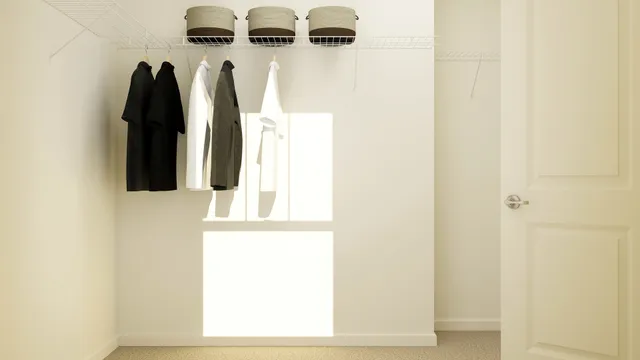 a view of walk in closet with clothes