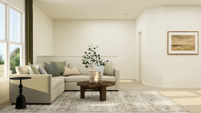 a living room with furniture and a potted plant