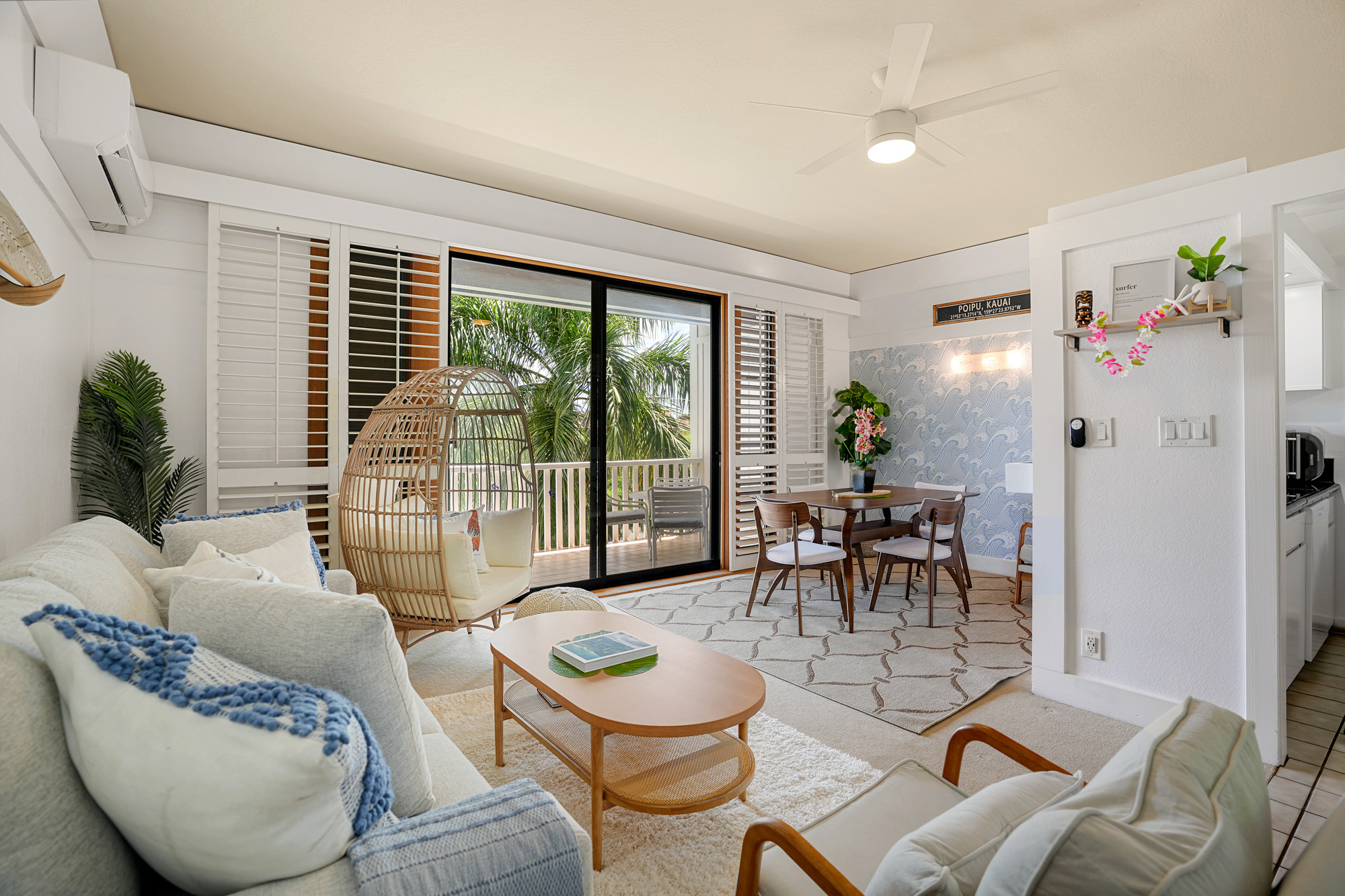 2253 Poipu Road, Unit 309 Koloa, HI 96756 - Photo 1 of 25 a living room with furniture and a large window