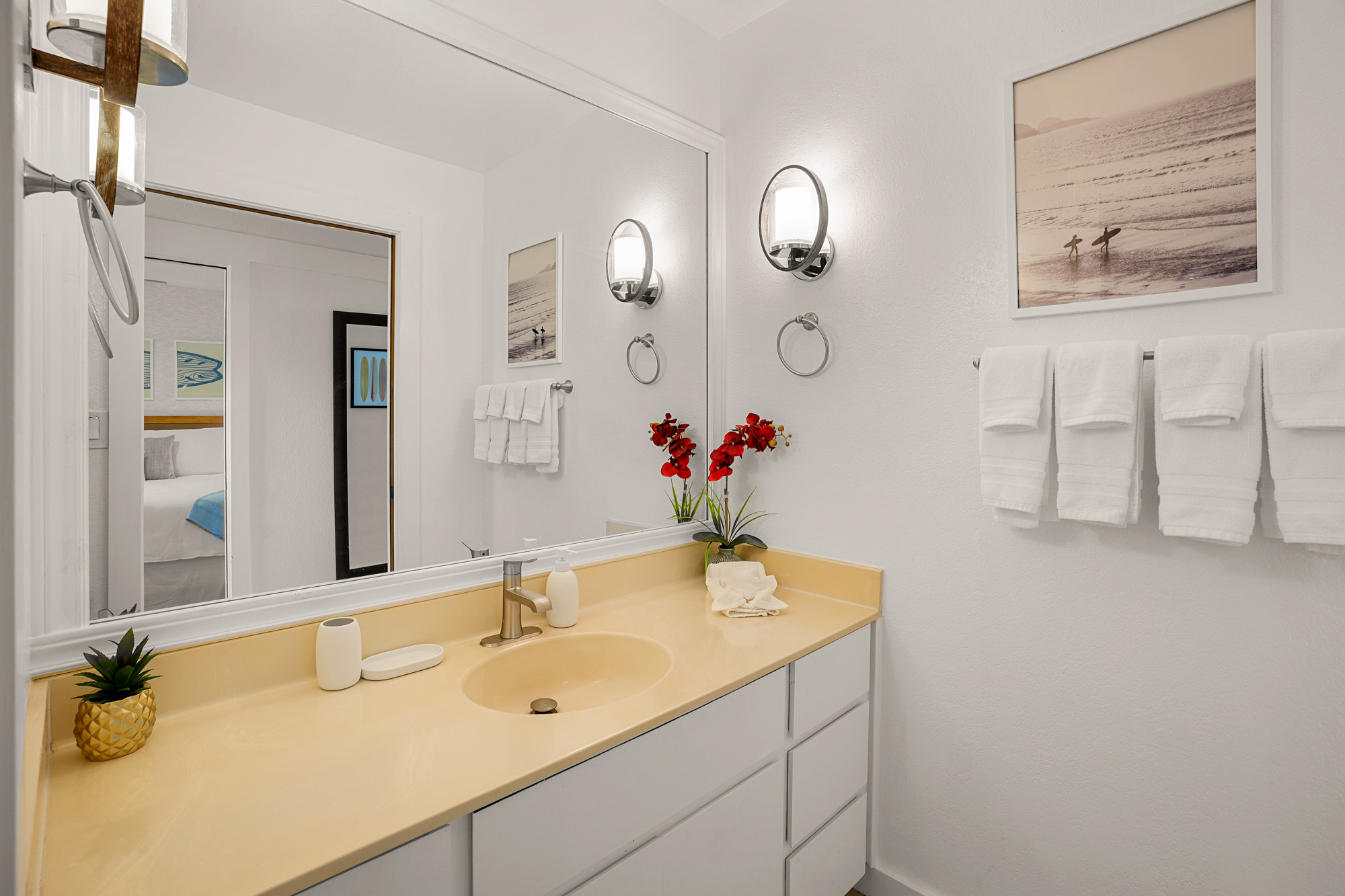 2253 Poipu Road, Unit 309 Koloa, HI 96756 - Photo 19 of 25 a bathroom with a granite countertop sink a mirror and a shower