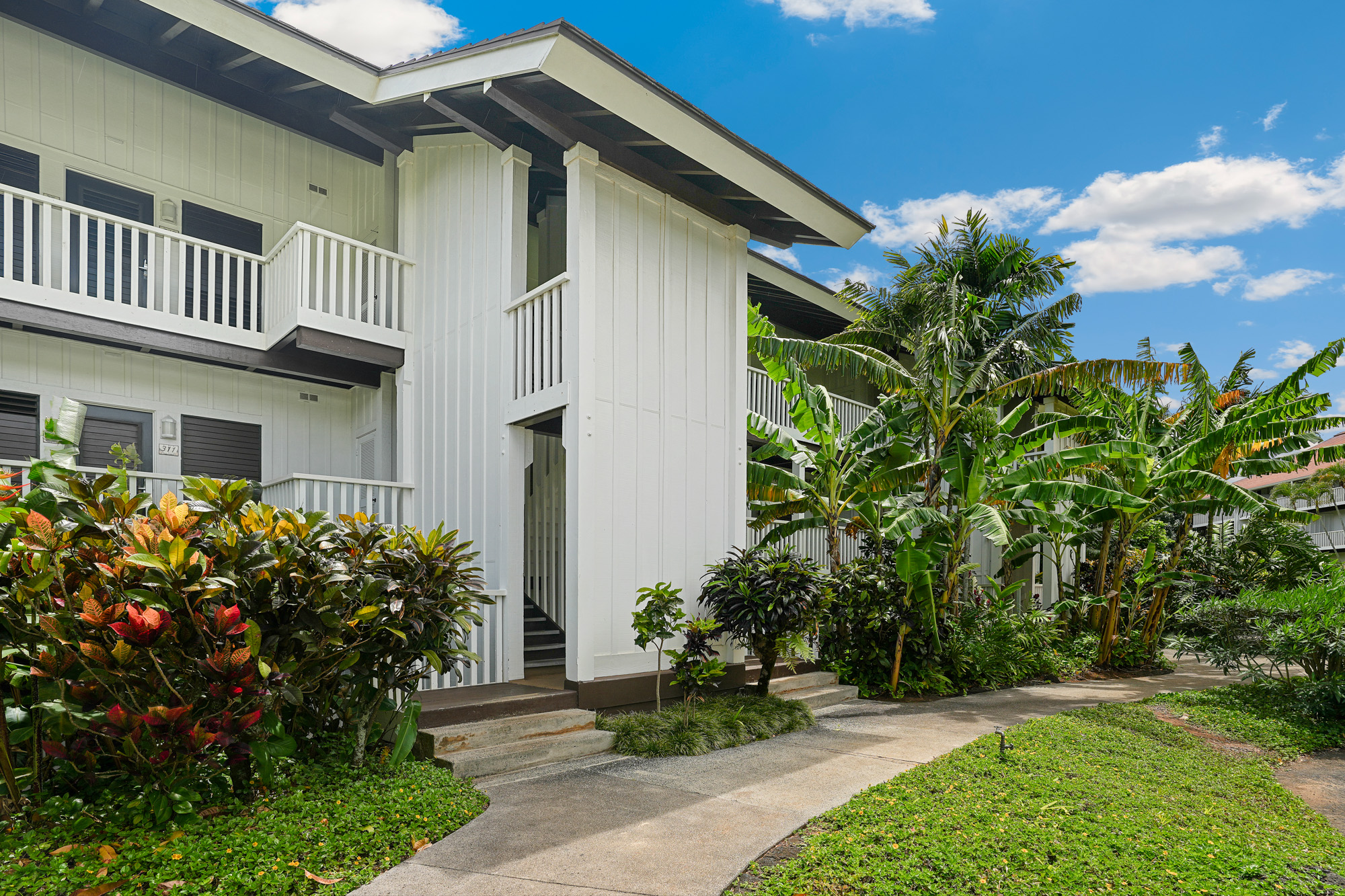 2253 Poipu Road, Unit 309 Koloa, HI 96756 - Photo 3 of 25 a front view of a house with garden
