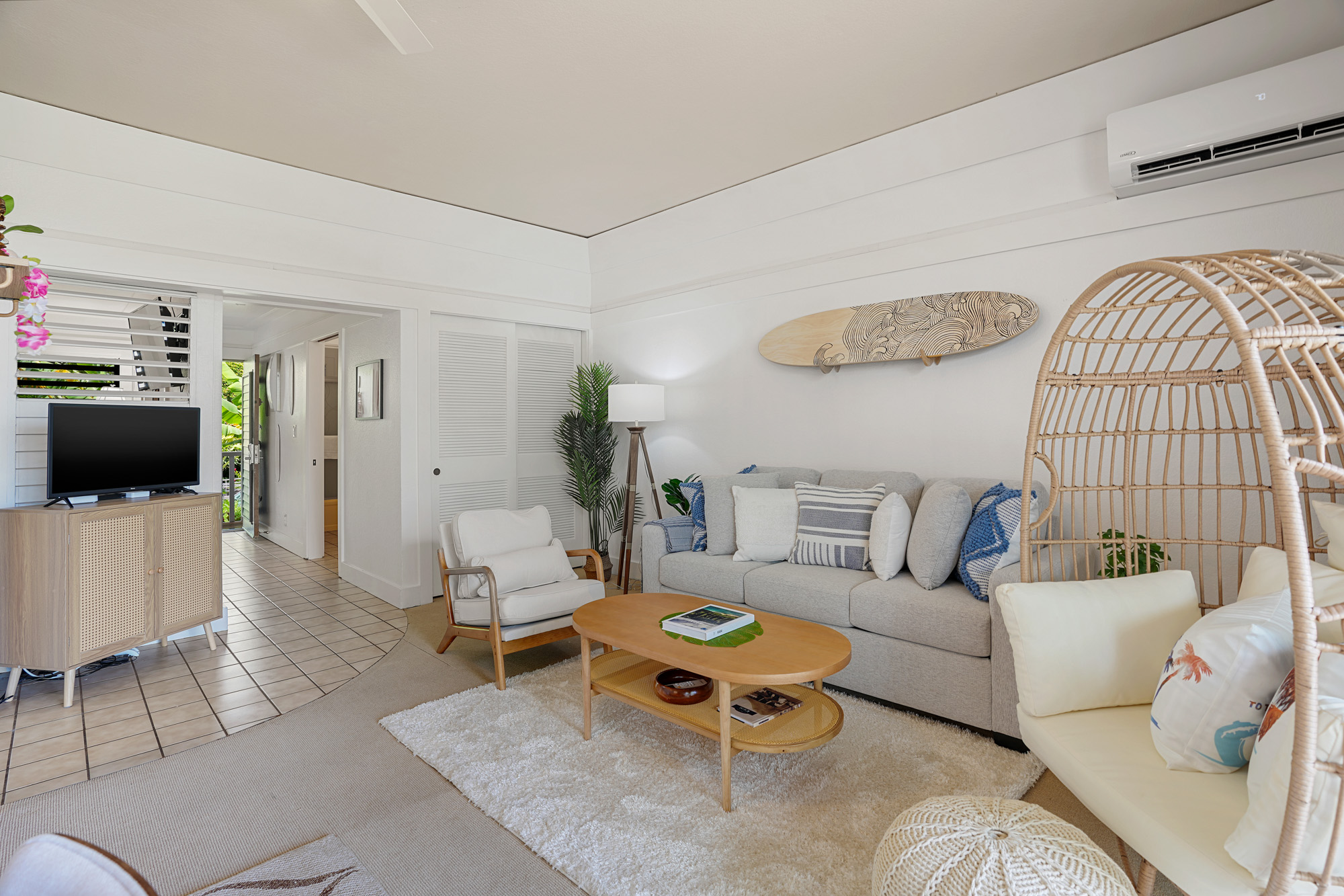 2253 Poipu Road, Unit 309 Koloa, HI 96756 - Photo 6 of 25 a living room with furniture and a flat screen tv