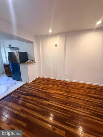 a bedroom with a bed and a view of closet