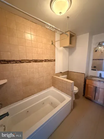 a bathroom with a bathtub and shower