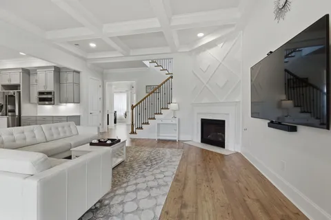 a kitchen with stainless steel appliances granite countertop a stove a sink dishwasher and a refrigerator