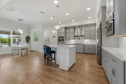 a open kitchen with cabinets and stainless steel appliances