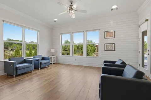 a room with a bed and wooden floor