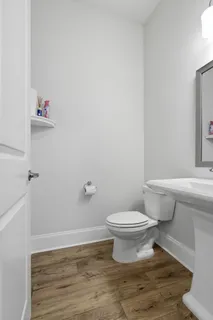 a spacious bedroom with a bed and a flat screen tv