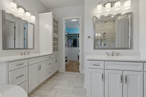 a large white bed in a white room