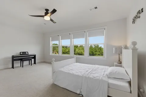 a living room with furniture and a bathroom