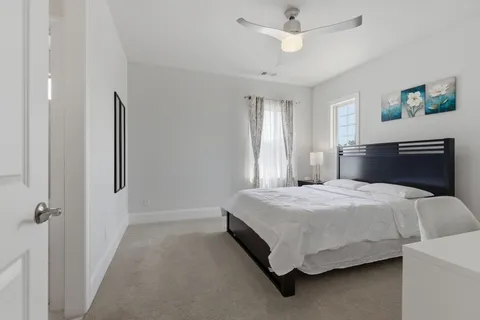 a room with a bed and a night stand