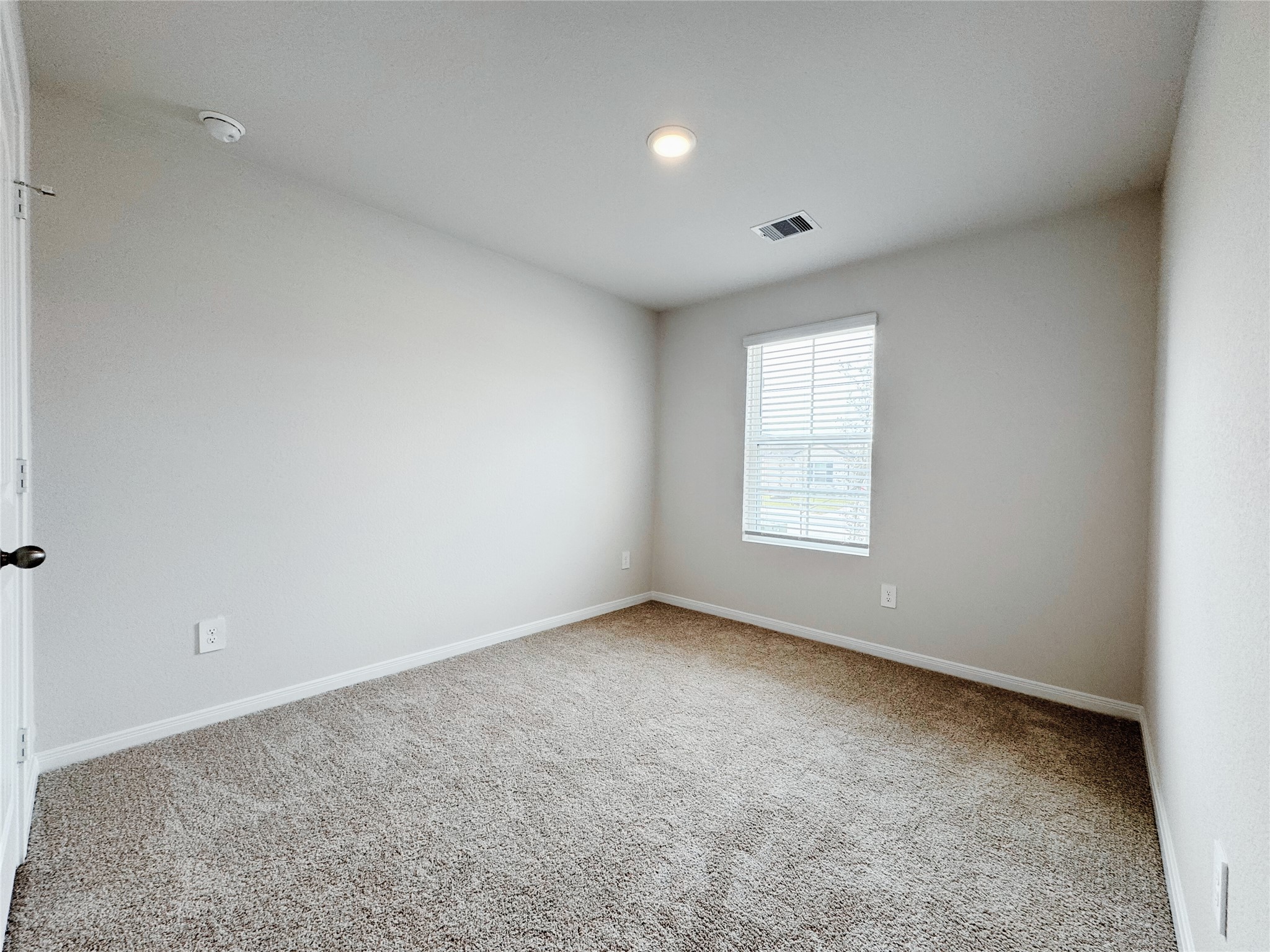 204 Addison Place Lockhart, TX 78644 - Photo 21 of 39 Unfurnished room with light colored carpet and baseboards