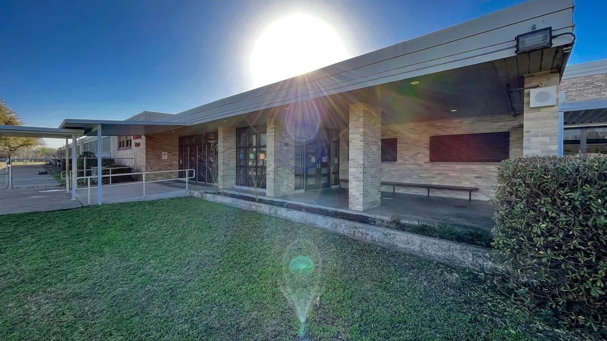 204 Addison Place Lockhart, TX 78644 - Photo 34 of 39 Back of property featuring brick siding, a patio area, and a lawn