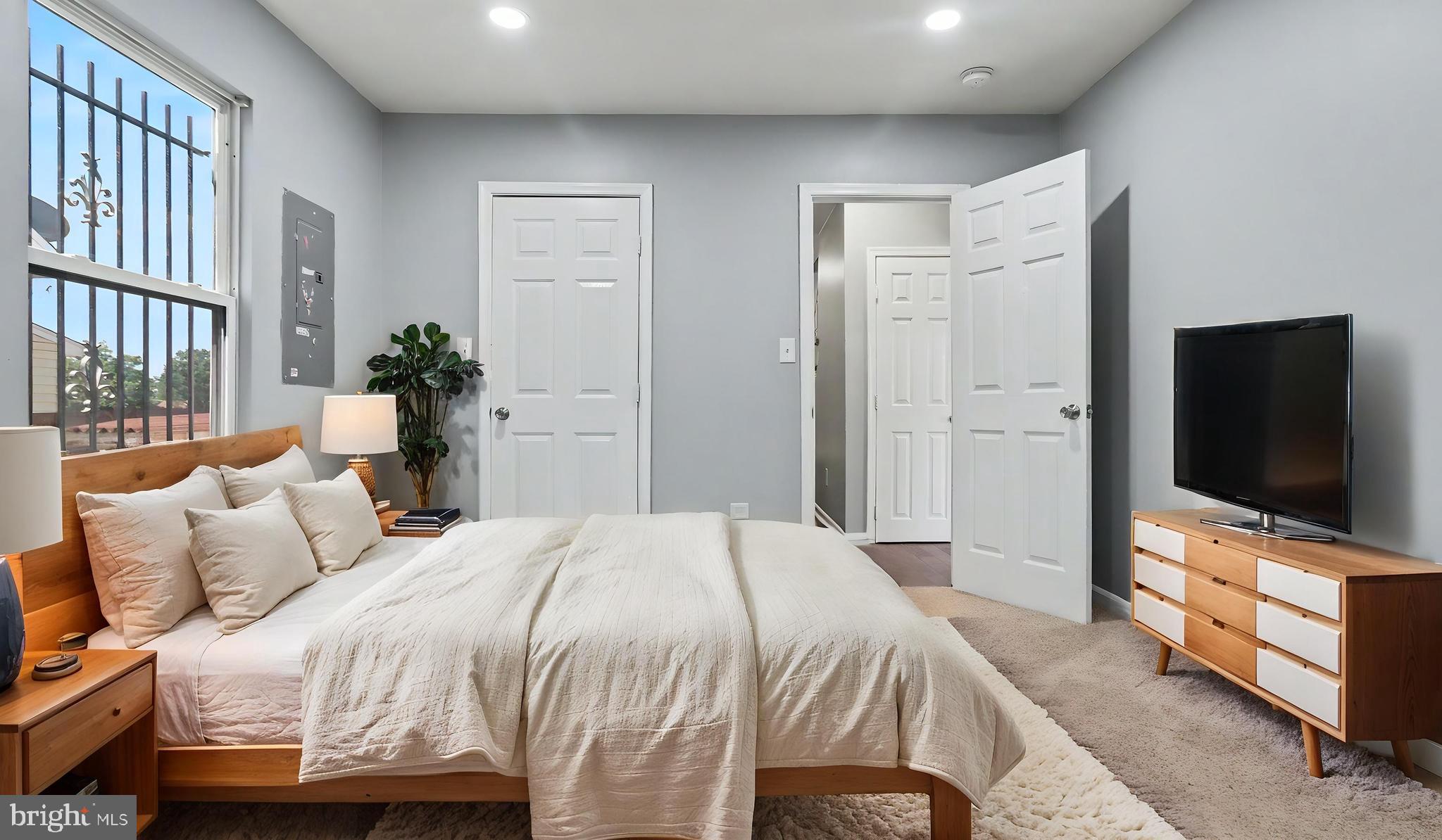 4203 Shell Street Capitol Heights, MD 20743 - Photo 27 of 47 a bedroom with a bed and a flat screen tv