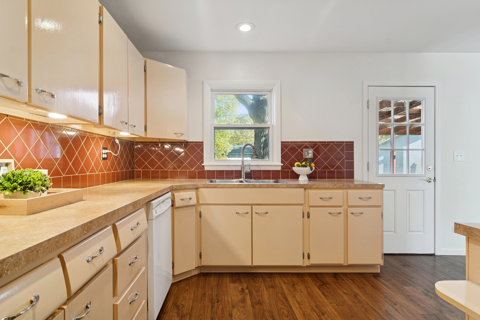 36 Crestview Terrace Buffalo Grove, IL 60089 - Photo 18 of 30 a kitchen with granite countertop white cabinets and wooden floor