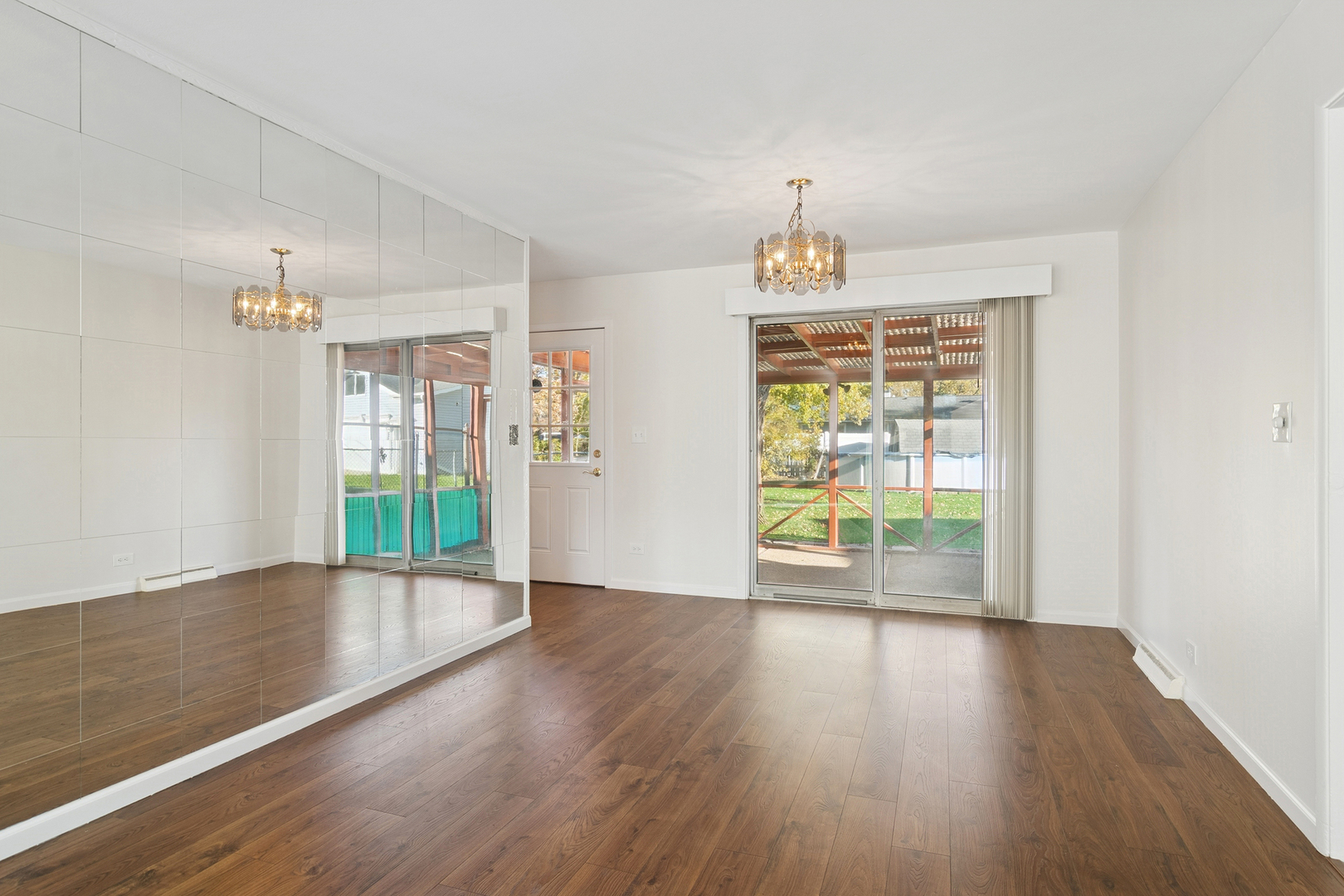 36 Crestview Terrace Buffalo Grove, IL 60089 - Photo 7 of 30 a view of an empty room with wooden floor and a window
