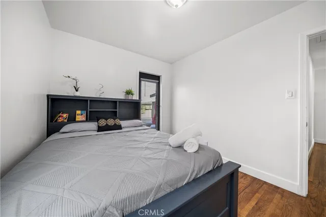 a bedroom with a bed and a fireplace