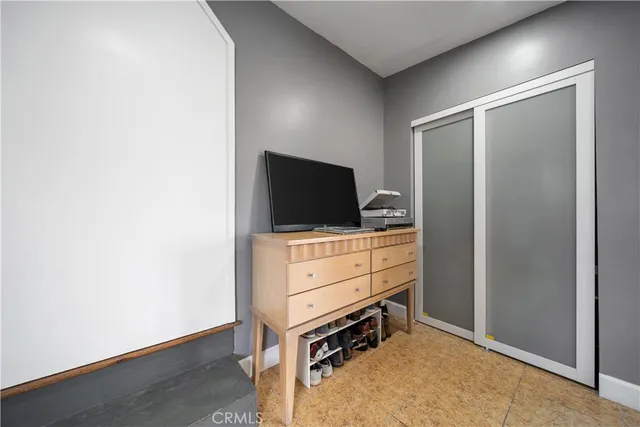 a room with furniture and flat screen tv