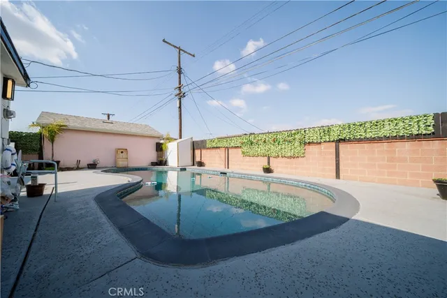 a view of a swimming pool with a patio