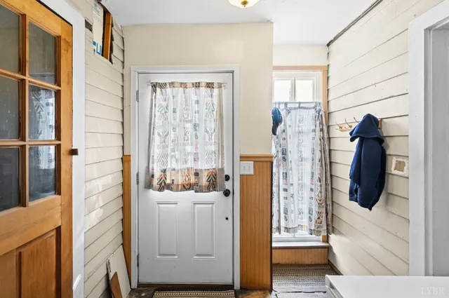 a bathroom with a window and a shower