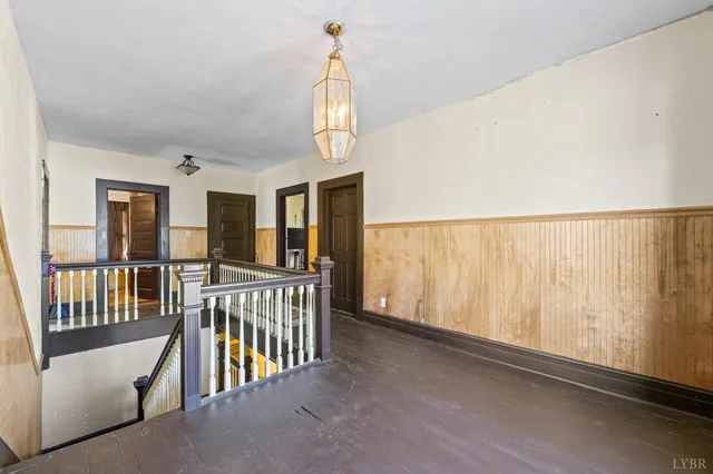 a bedroom with a bed dresser and a window