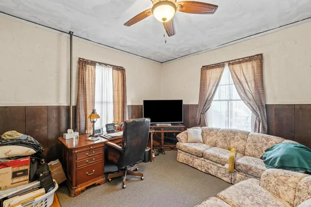 a view of a backyard with sitting area and furniture