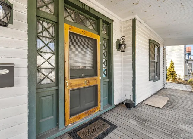 a view of a door and a window