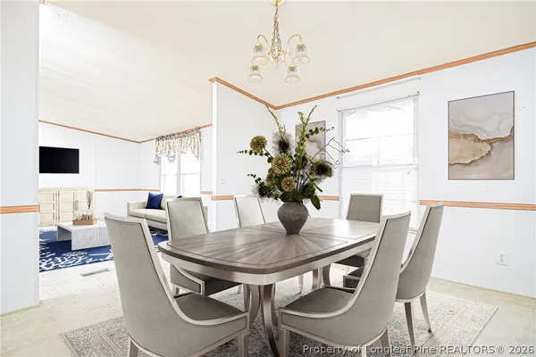 a kitchen with granite countertop a sink stainless steel appliances and cabinets