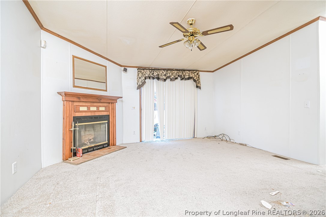 6331 Sandy Creek Road Stedman, NC 28391 - Photo 20 of 29 a view of a livingroom with a ceiling fan