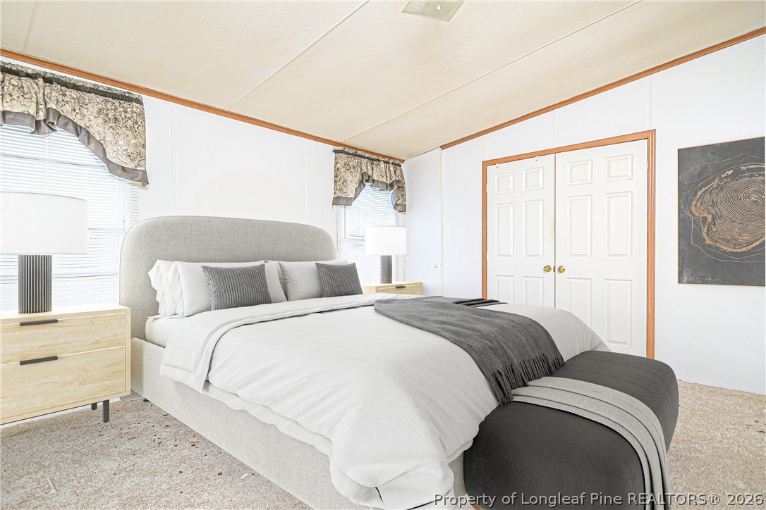 6331 Sandy Creek Road Stedman, NC 28391 - Photo 22 of 29 a bedroom with a bed and a window
