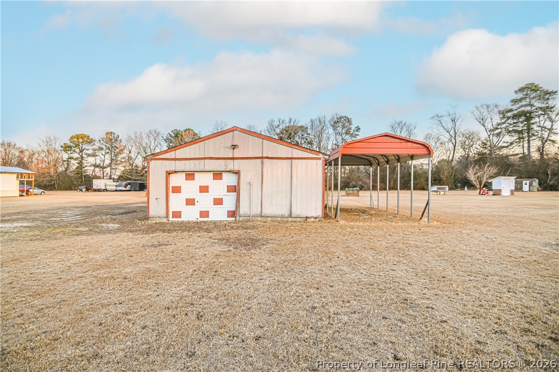 6331 Sandy Creek Road Stedman, NC 28391 - Photo 28 of 29 a house with a outdoor space