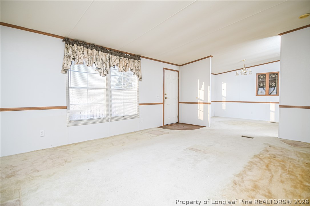 6331 Sandy Creek Road Stedman, NC 28391 - Photo 5 of 29 a view of an empty room with a window
