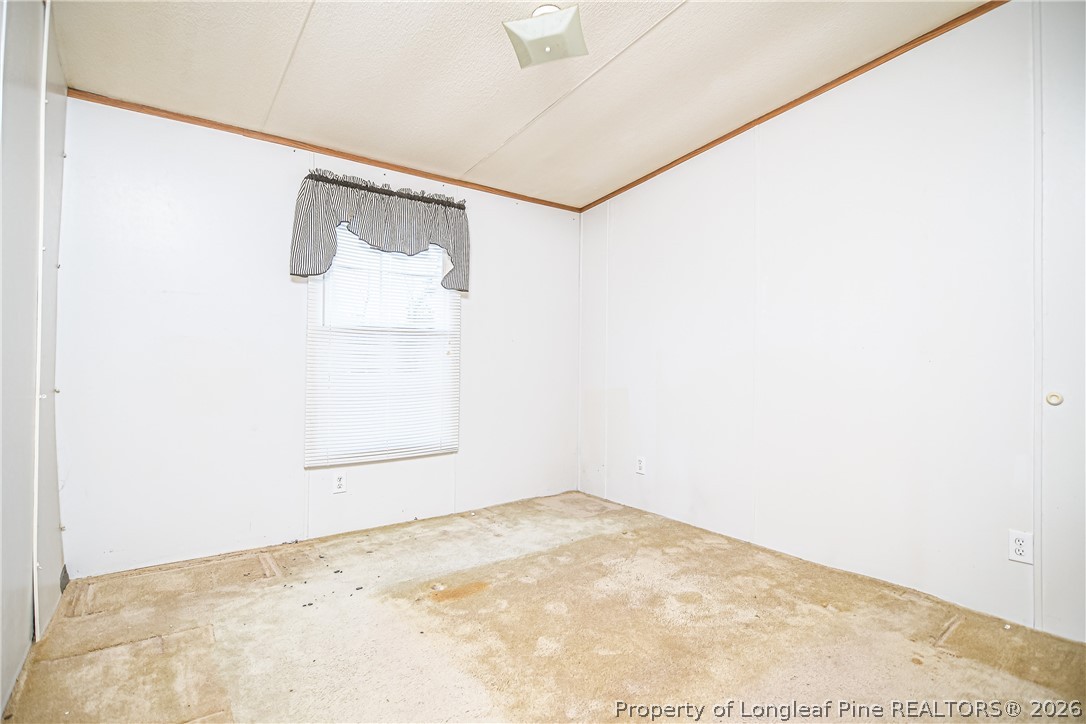 6331 Sandy Creek Road Stedman, NC 28391 - Photo 10 of 29 a view of a small space with a window