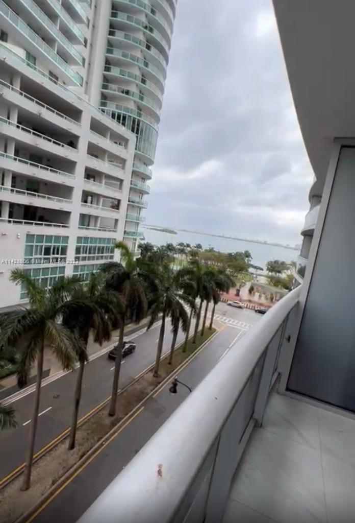 488 Northeast 18th Street, Unit 505 Miami, FL 33132 - Photo 2 of 35 a view of a balcony with potted plants and sky view