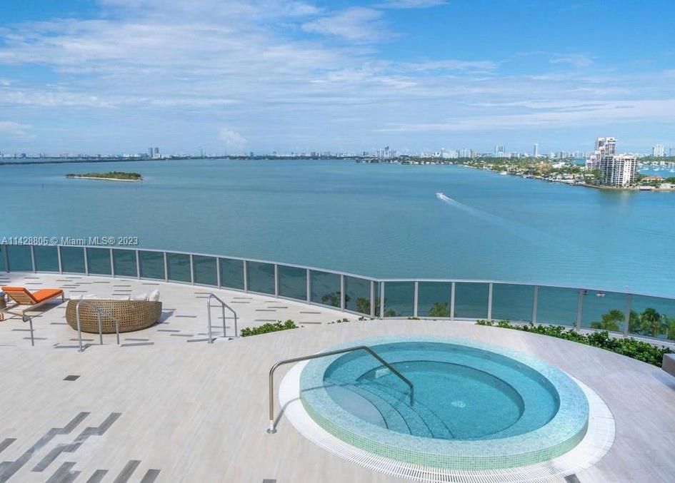 488 Northeast 18th Street, Unit 505 Miami, FL 33132 - Photo 23 of 35 a view of a swimming pool with an ocean view