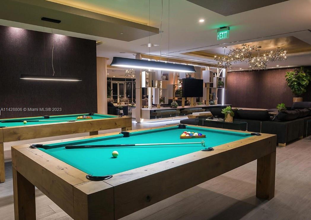 488 Northeast 18th Street, Unit 505 Miami, FL 33132 - Photo 26 of 35 a room with pool table table and chairs