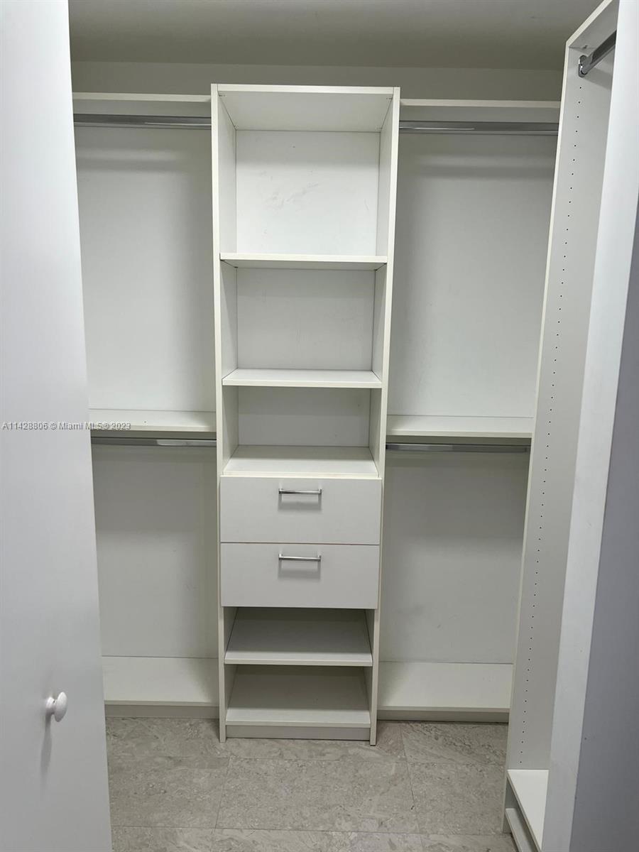 488 Northeast 18th Street, Unit 505 Miami, FL 33132 - Photo 8 of 35 a view of an empty walk in closet