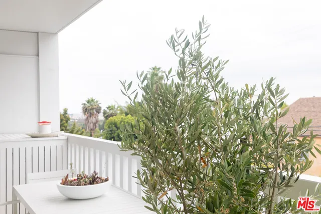 a table and chairs in a small yard