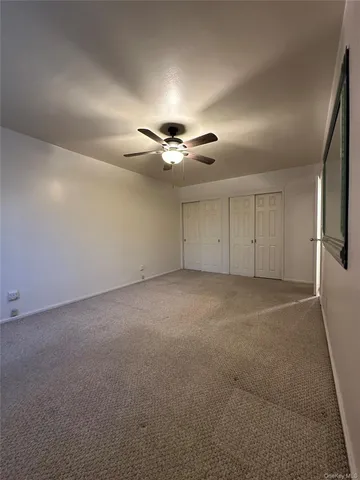a white refrigerator freezer and a stove sitting inside of a kitchen