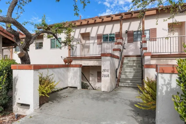 a front view of a house with a garage